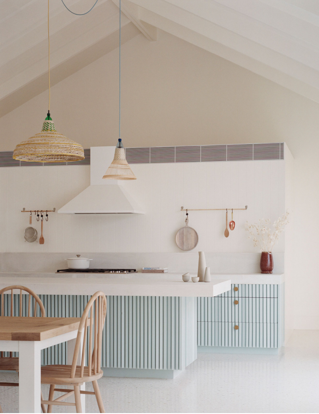 Modern Reeded pale blue kitchen cabinets in contemporary beach house