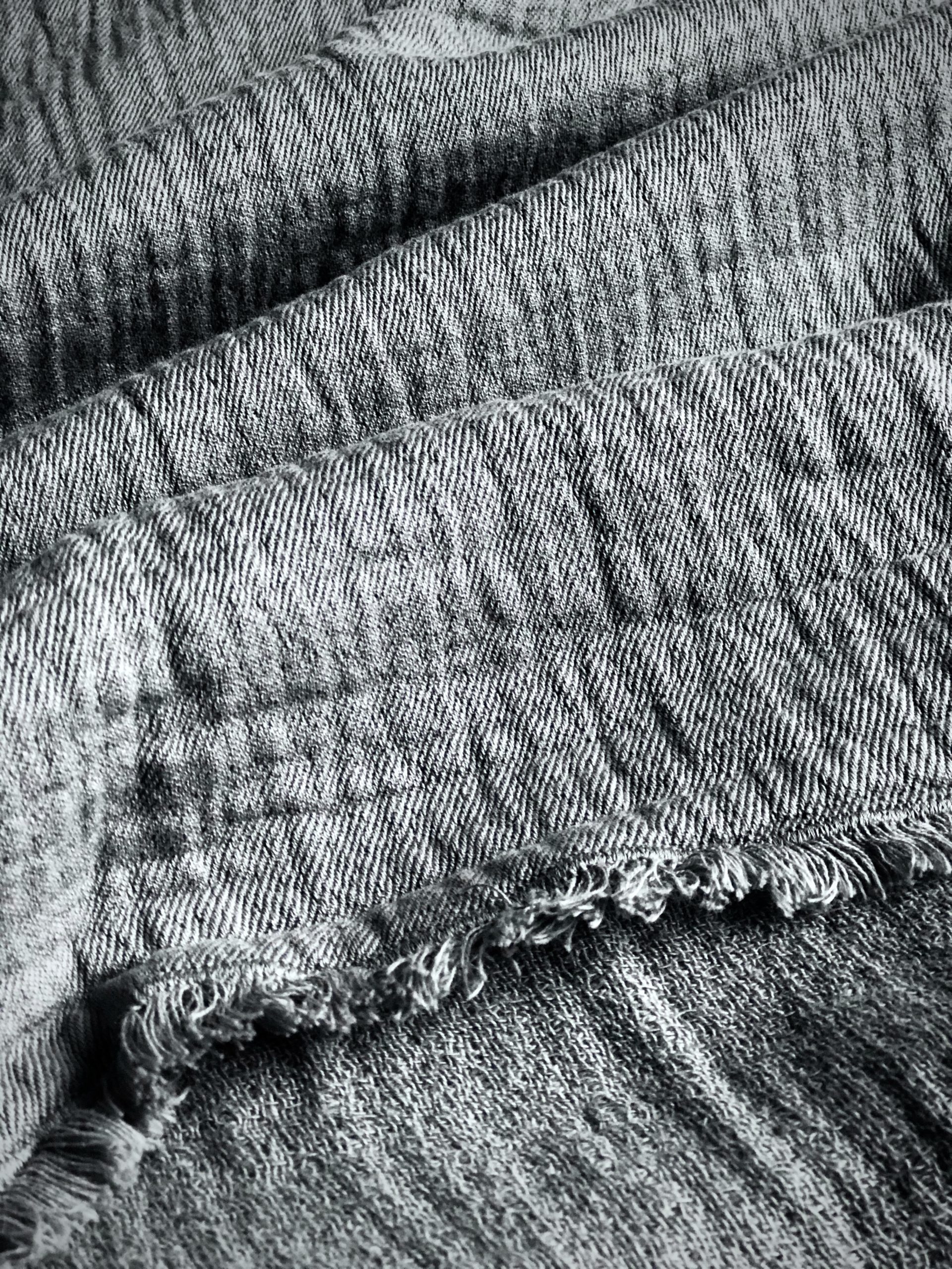 Textural detail of slate grey washed linen throw from John Lewis.