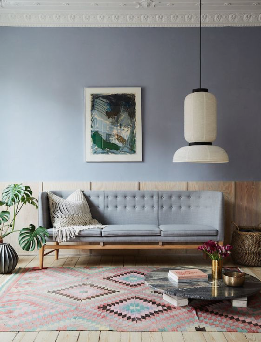 Modern Scandi Living room with pale blue and plywood walls, oversized pendant light.
